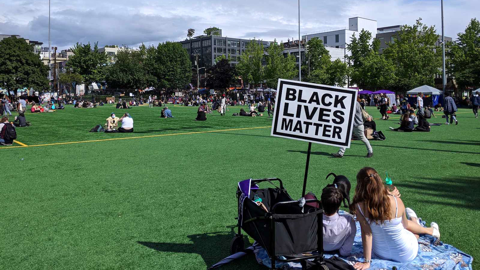 photo of Seattle autonomous CHOP zone picnic with black lives matter sign