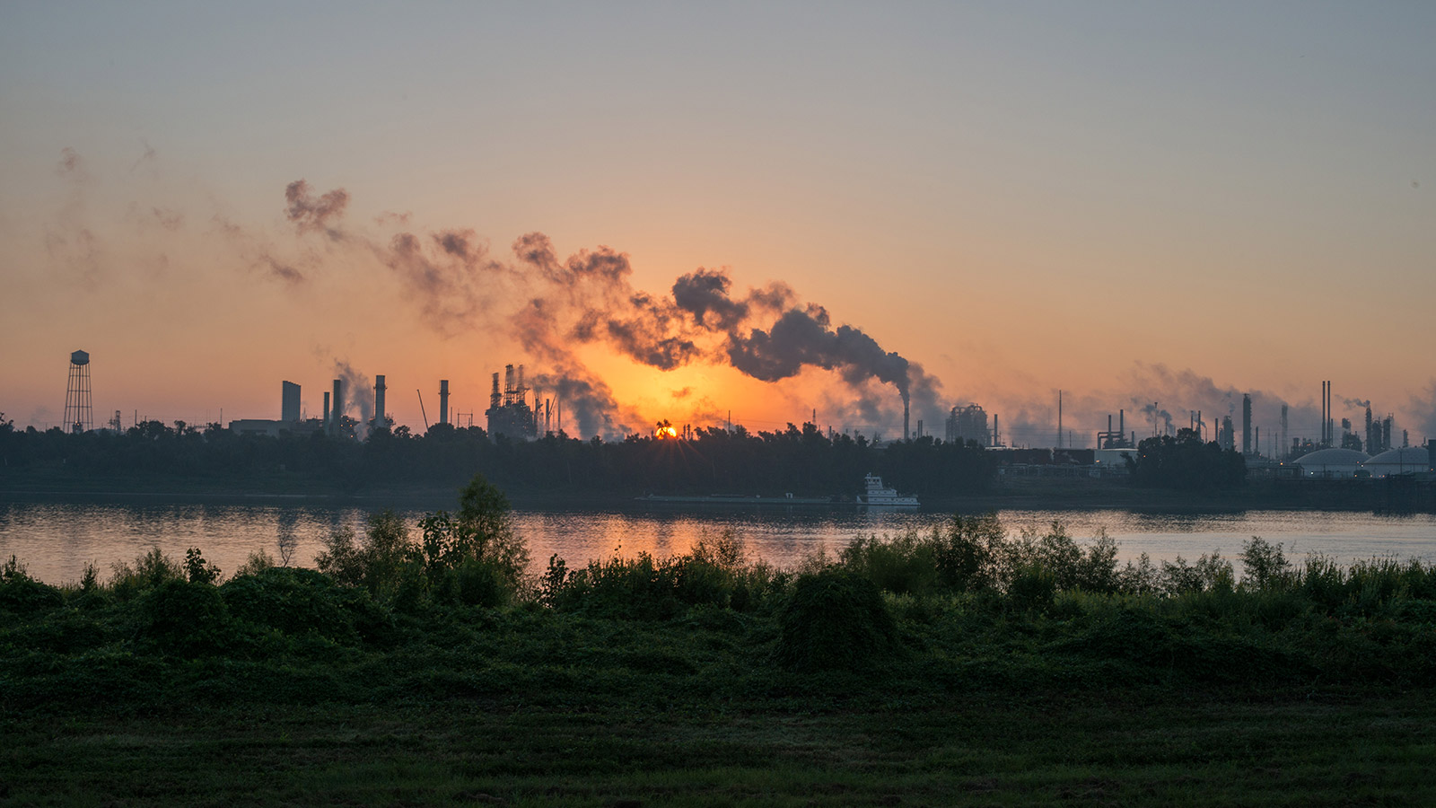 Smoke billows from one of many chemical plants in the area of Cancer Alley in Baton Rouge, Louisiana