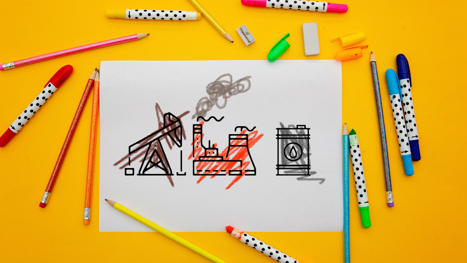 A piece of paper with an oil pump, a power plant, and cooling towers with markers and pencils surrounding the paper