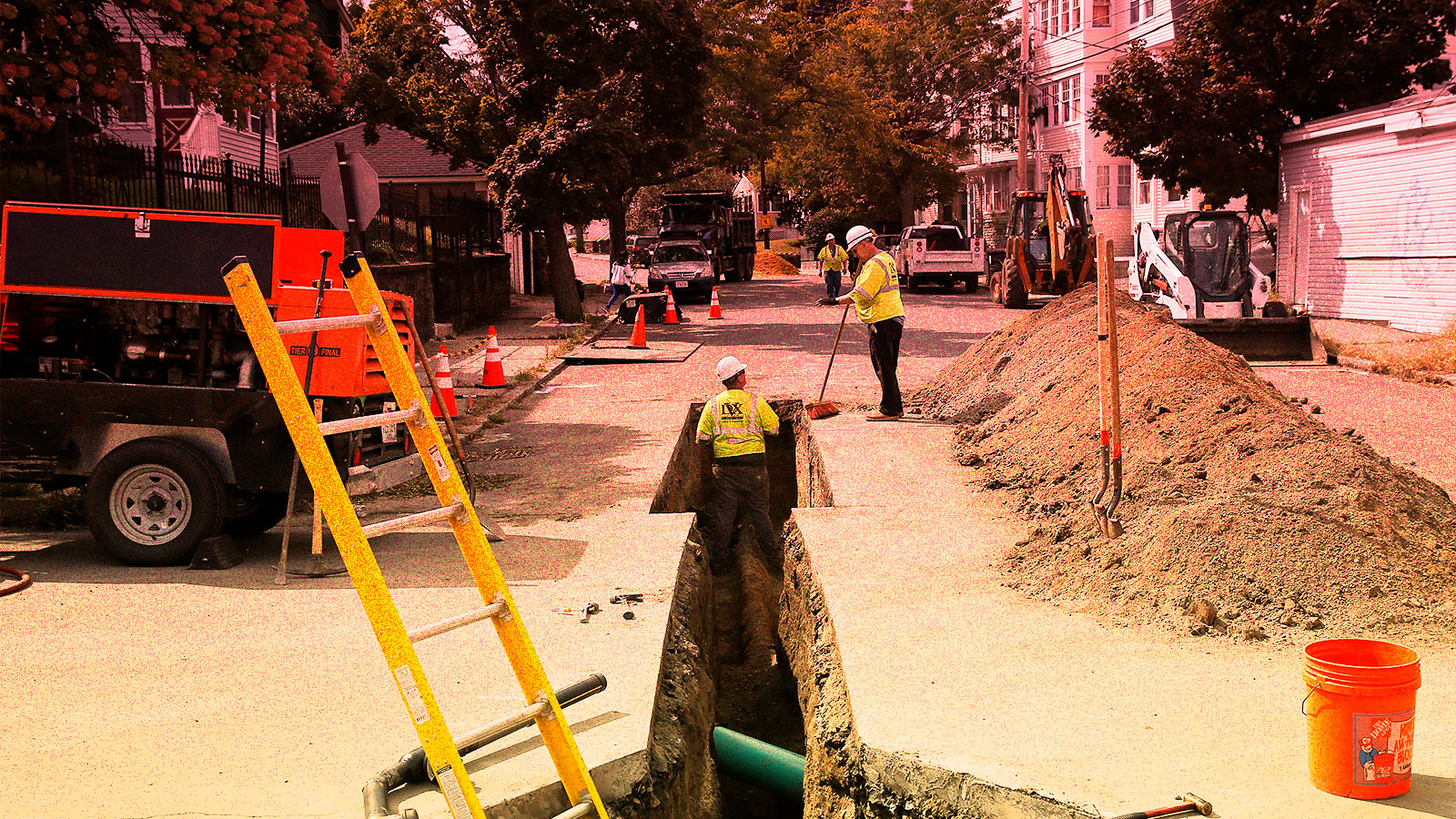A photo of gas workers digging a trench for pipes in Massachusetts