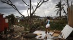 Resident Mirian Medina stands on her property about two weeks after Hurricane Maria swept through the island on October 5, 2017 in San Isidro, Puerto Rico