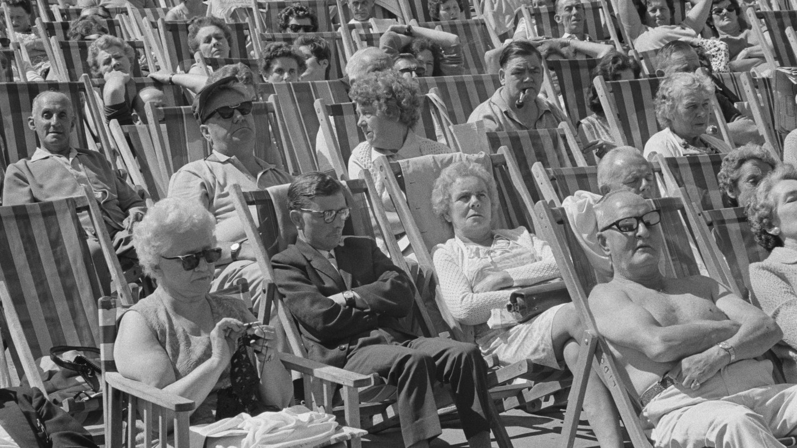 Black and white photo of rows of seniors in deckchairs in Margate, UK.