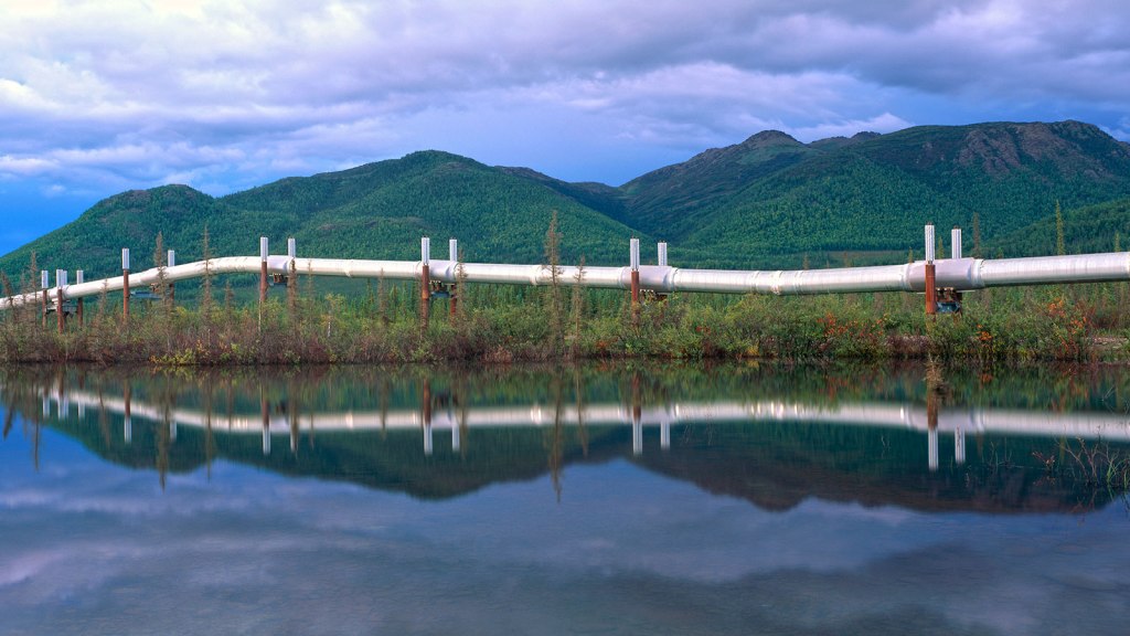 Trans-Alaska pipeline reflected in a pond