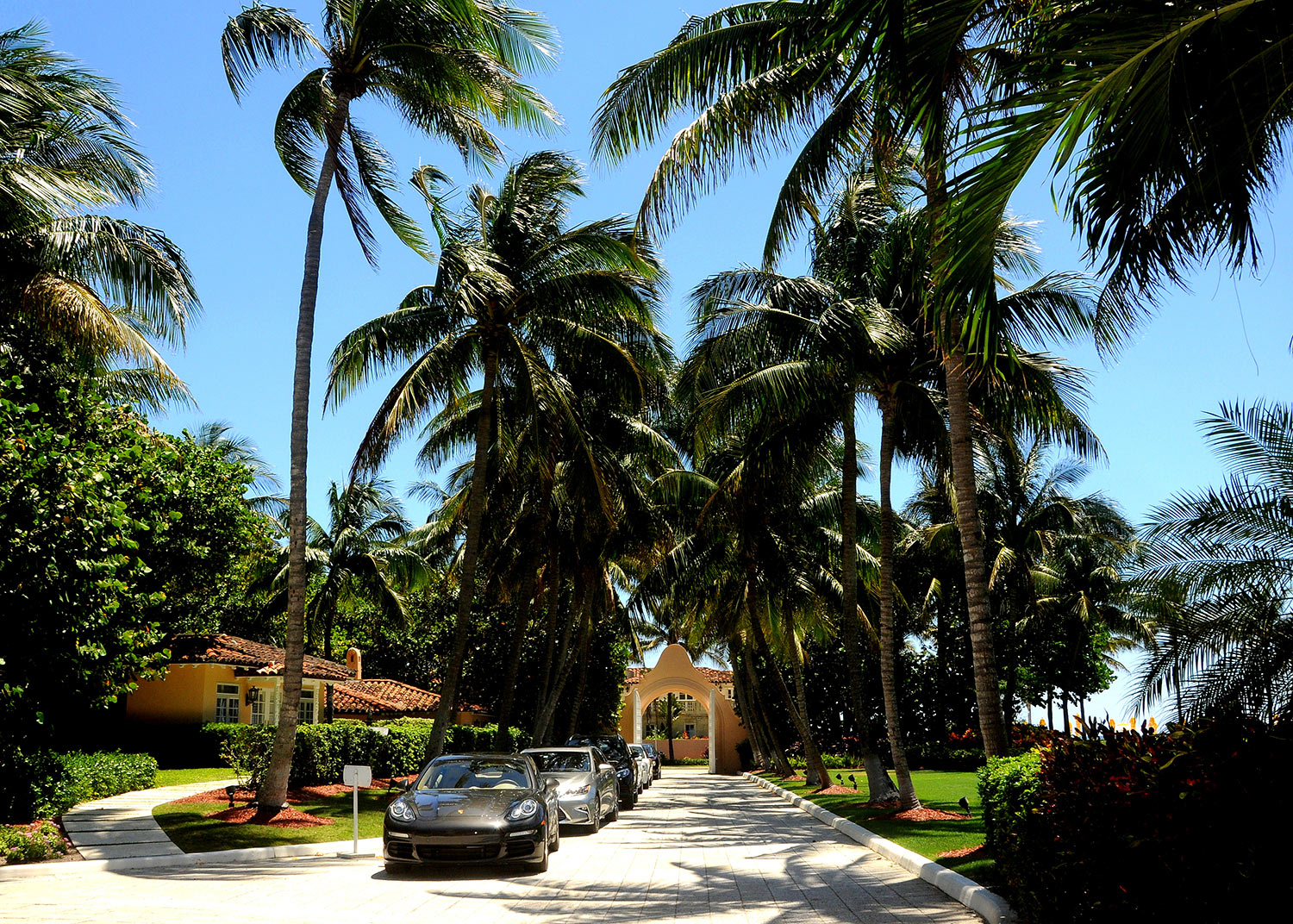 Sports cars line a driveway at President Donald Trump’s Mar-a-Lago resort in Palm Beach, Florida.