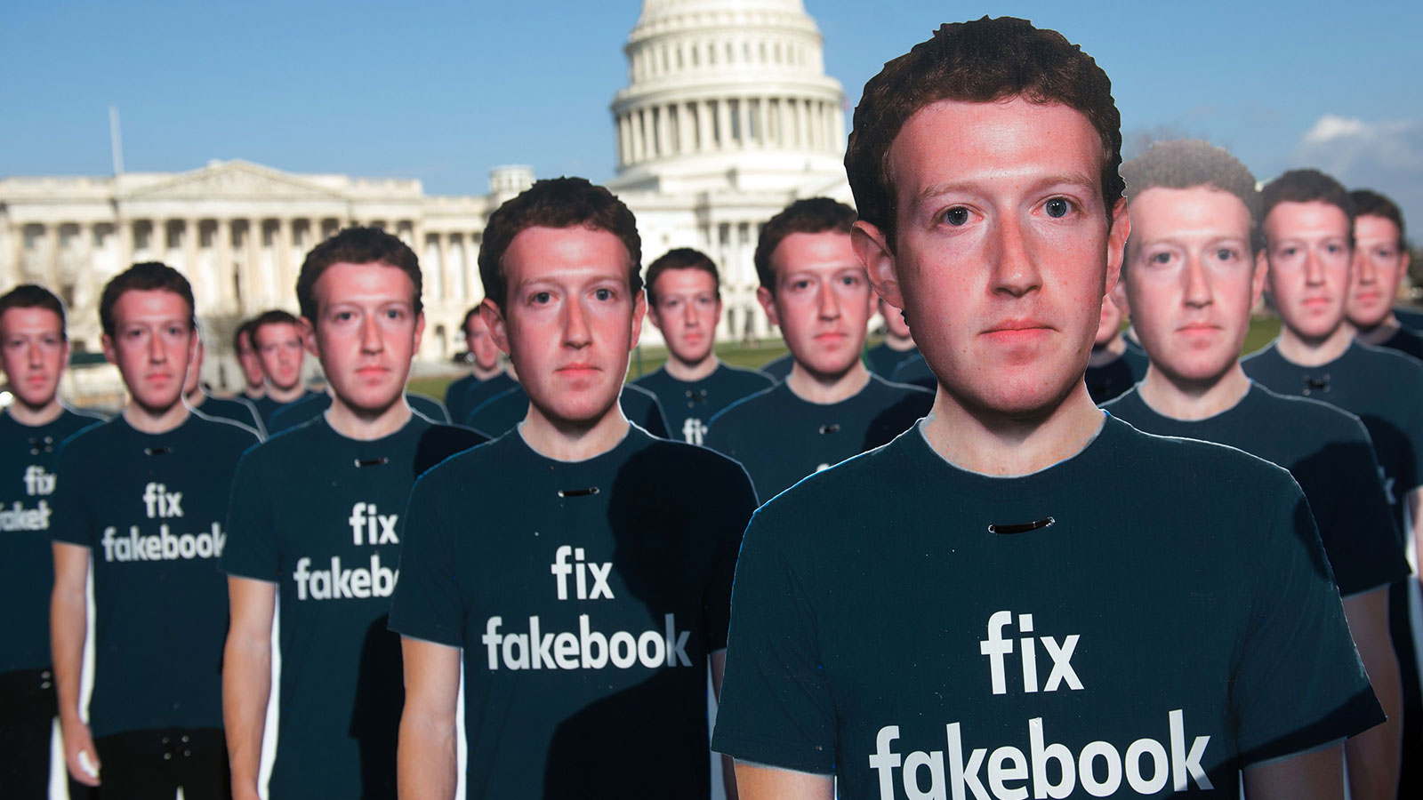 One hundred cardboard cutouts of Facebook founder and CEO Mark Zuckerberg stand outside the US Capitol