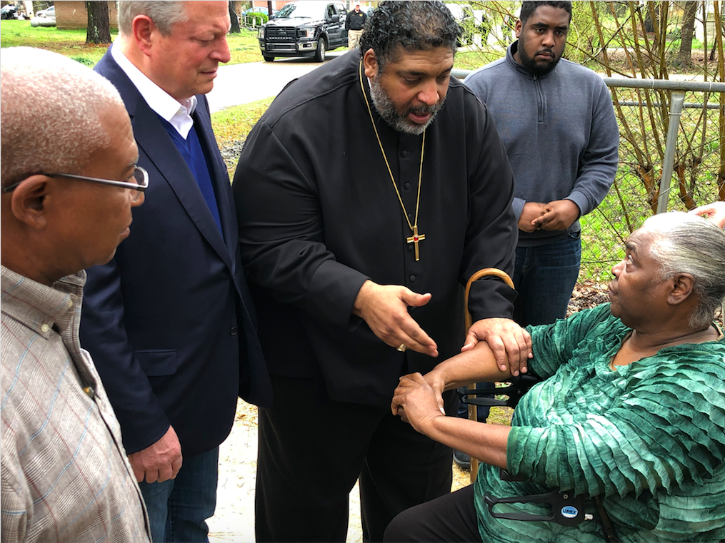 Former Vice President Al Gore and Reverend William Barber II speak with Lowndes County resident Charlie Mae.