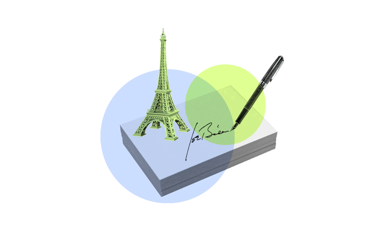 President Biden's signature and a tiny Eiffel tower, representing his executive order for the US to rejoin the Paris Climate Agreement
