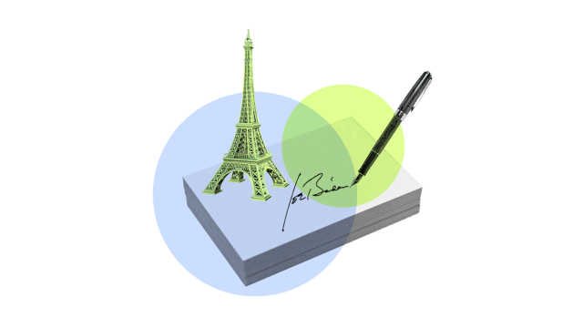 President Biden's signature and a tiny Eiffel tower, representing his executive order for the US to rejoin the Paris Climate Agreement