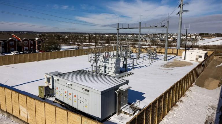 A photograph of snow covered electric power equipment in Texas.