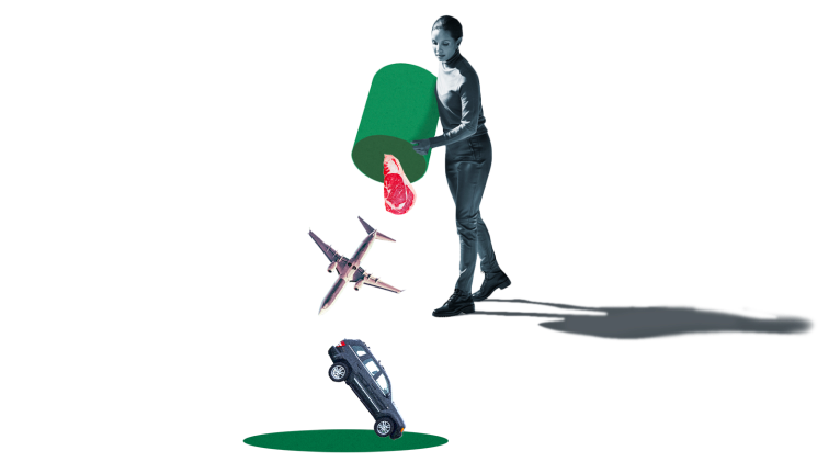 A woman dumping a steak, an airplane, and a car out of a barrel into a hole