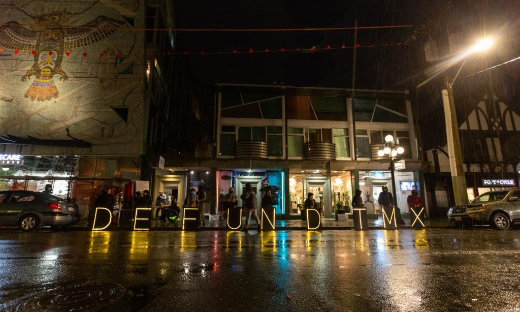 protesters on road at night