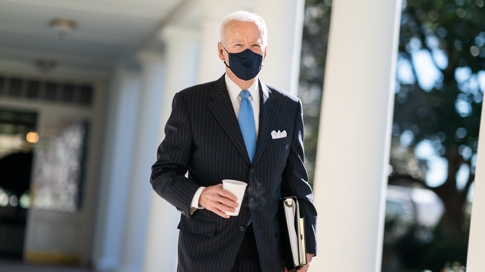 Biden walking outside with mask on