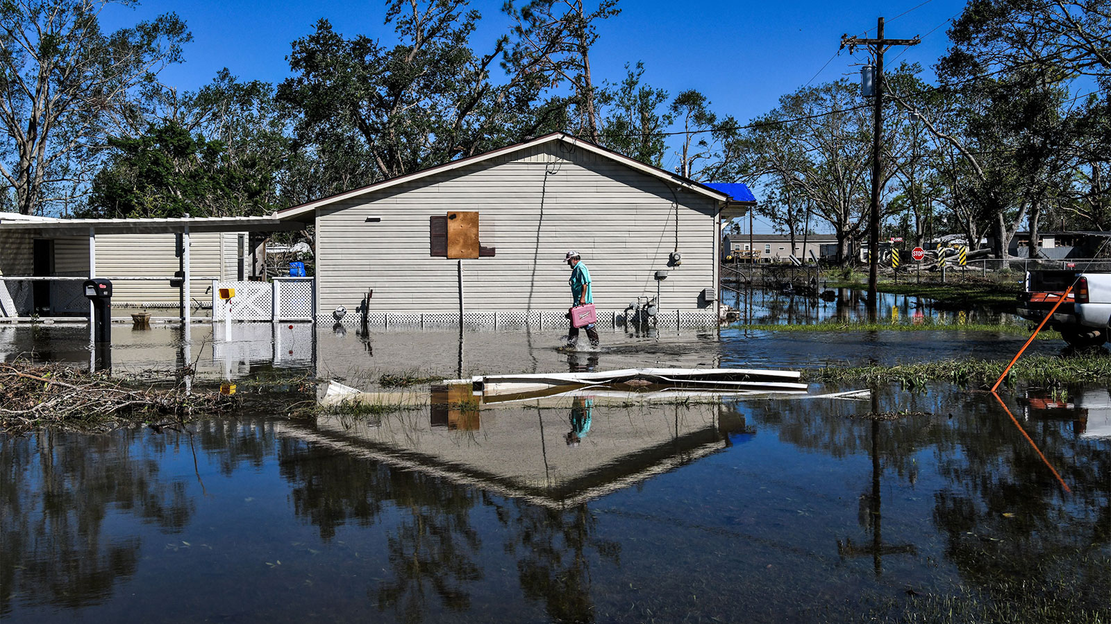 A man in front of his house in flooded Lake Charles, Louisiana