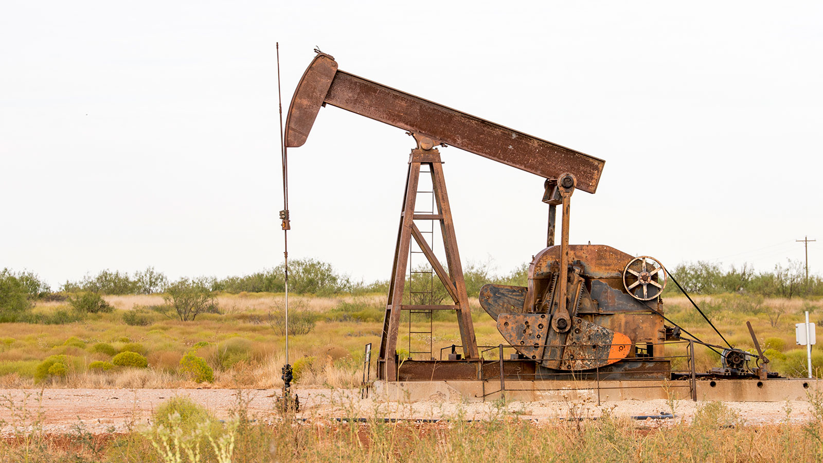 Photograph of a rusty oil pumpjack