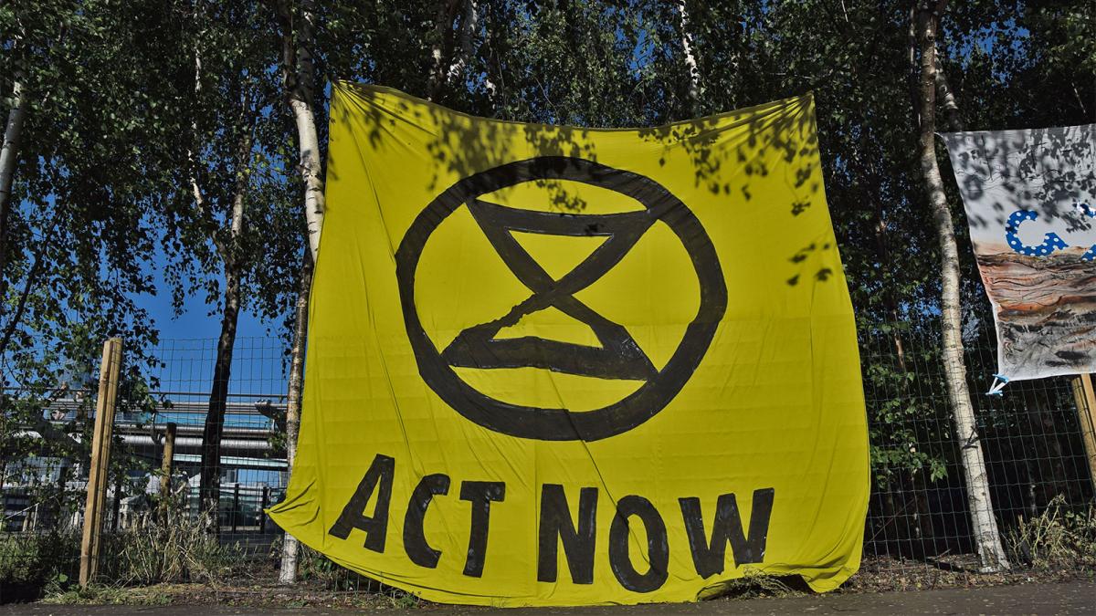 An Extinction Rebellion banner that reads "act now"