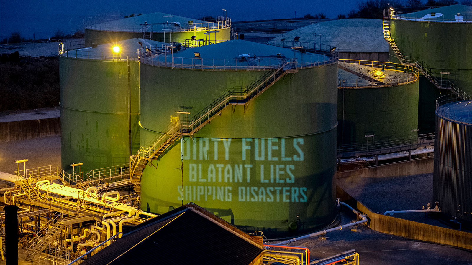 A projected slogan protesting the fuel shipping industry