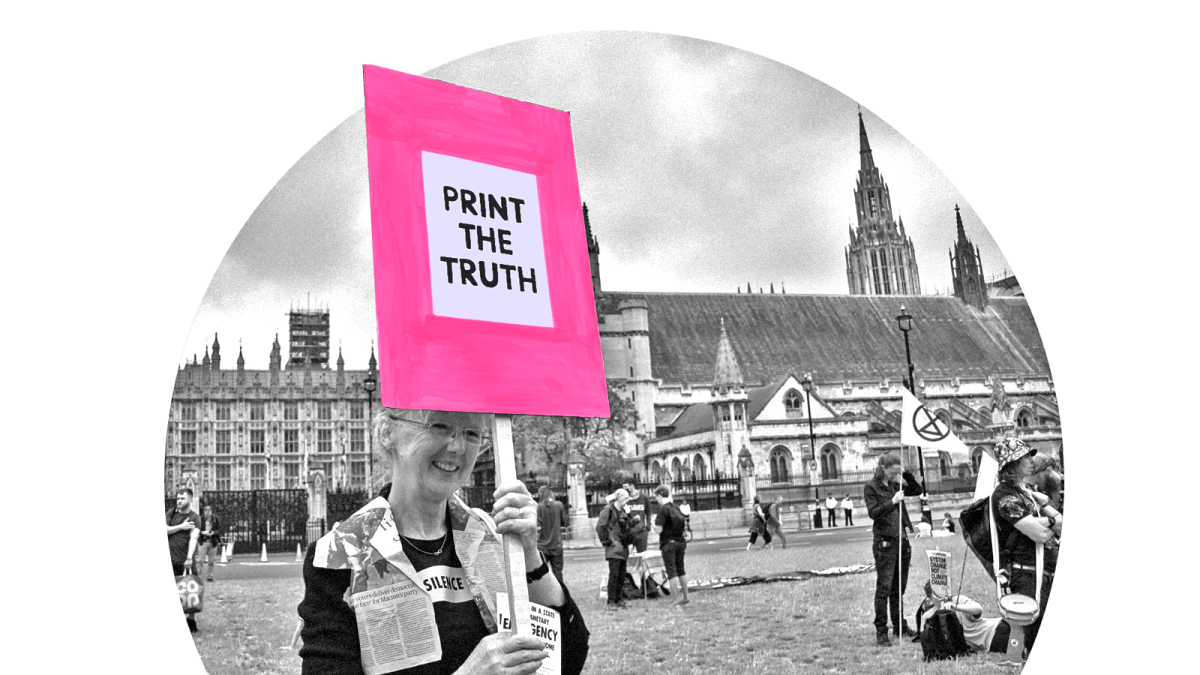 A woman at a protest holding a sign that says "print the truth"