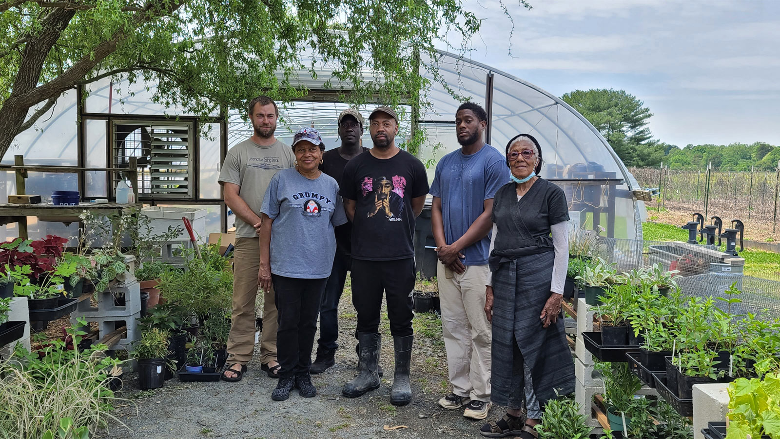 The founders of the Triad Farmers Network standing in front of a hoop house