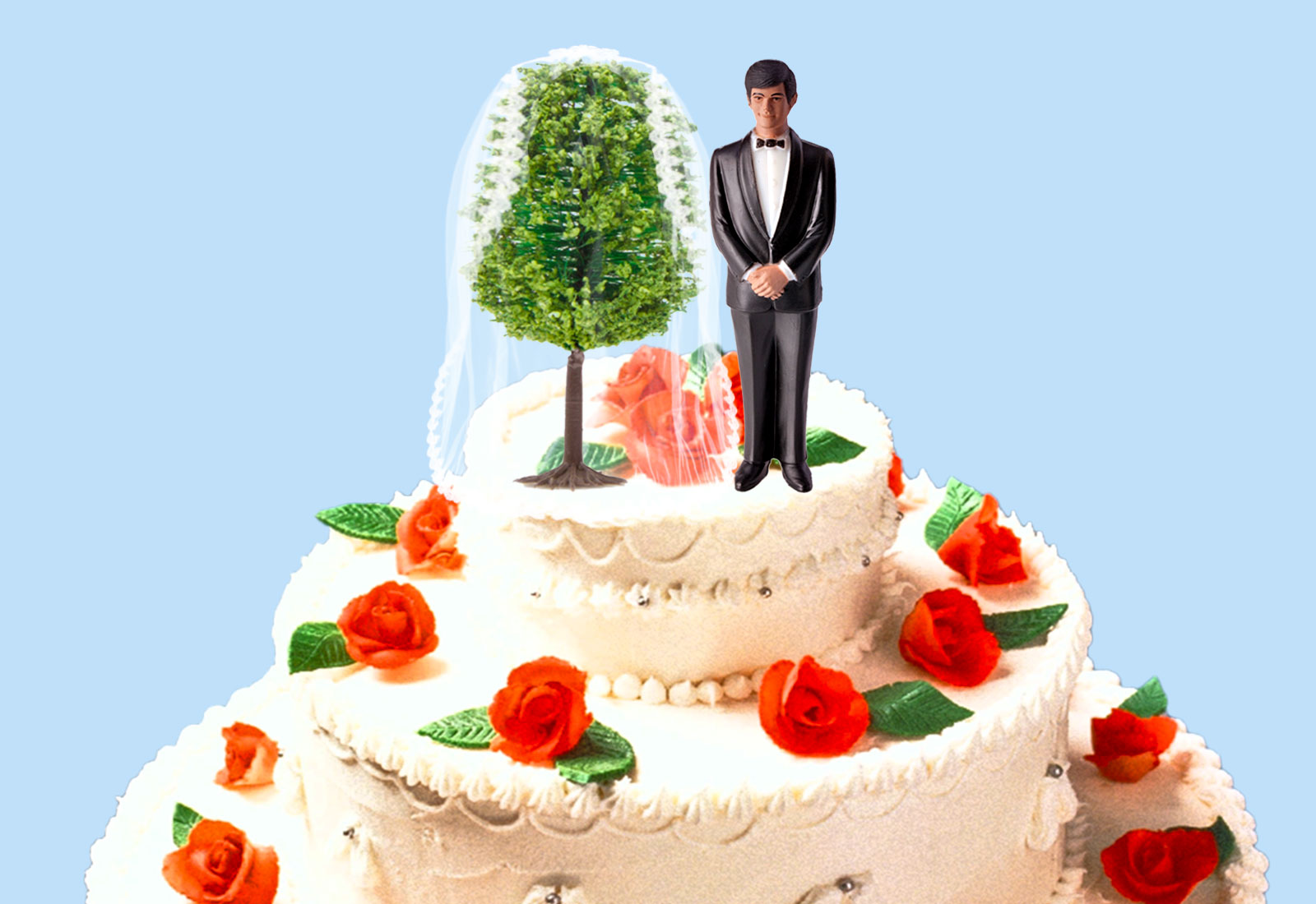Wedding cake with a groom topper and a tree wearing a bridal veil