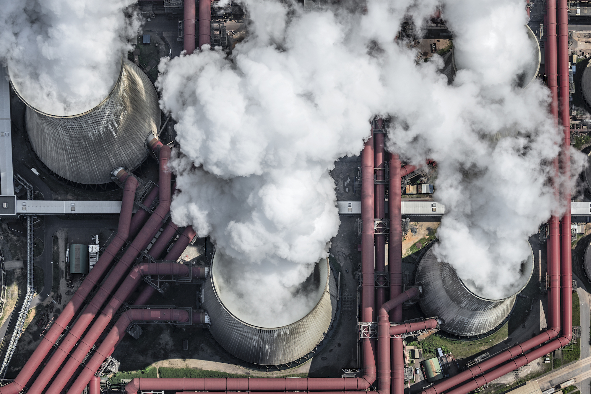 Aerial view of steaming cooling towers