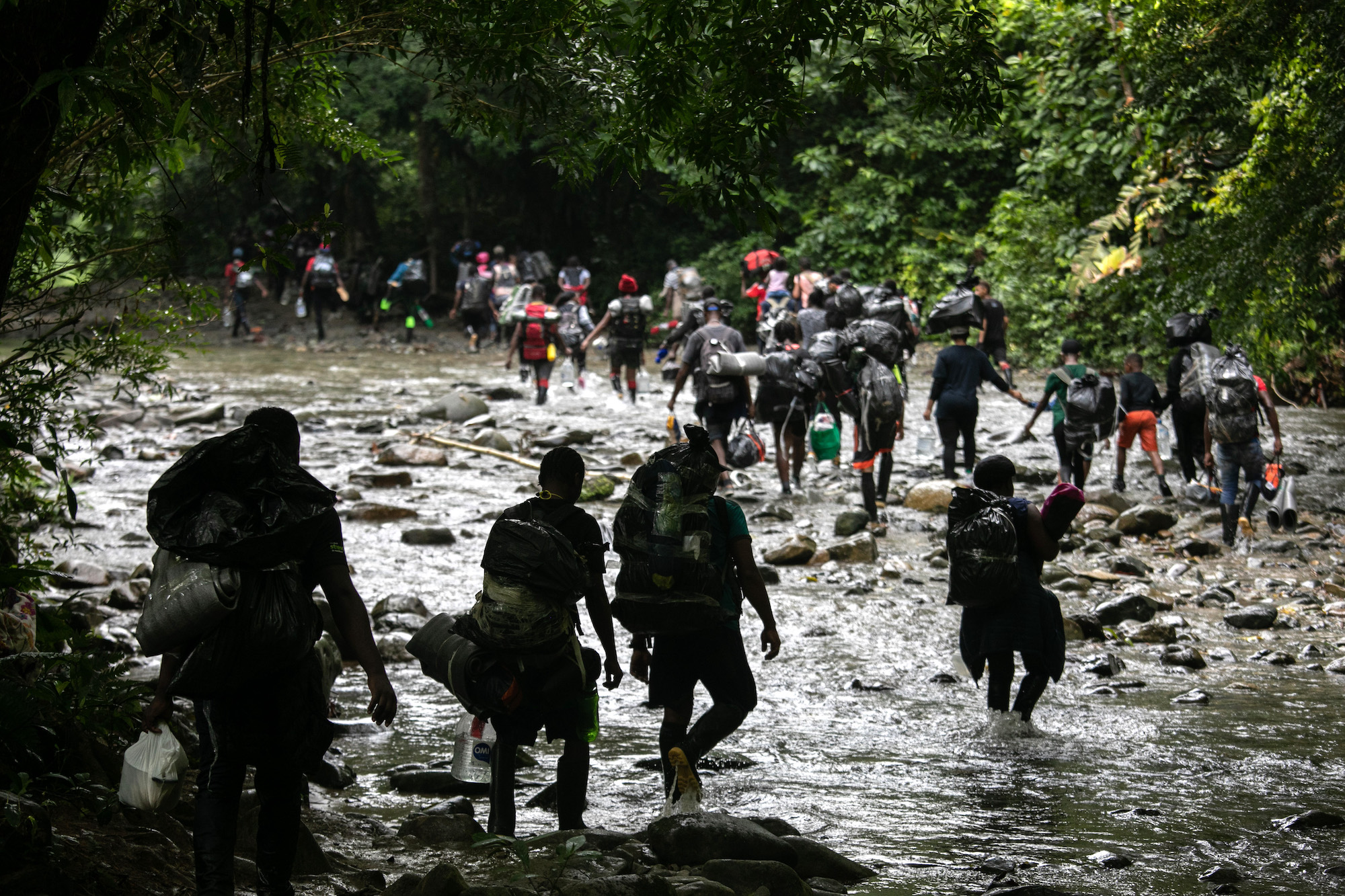Migrants, most from Haiti, trek through the Darien Gap between Colombia and Panama, on their journey towards the United States