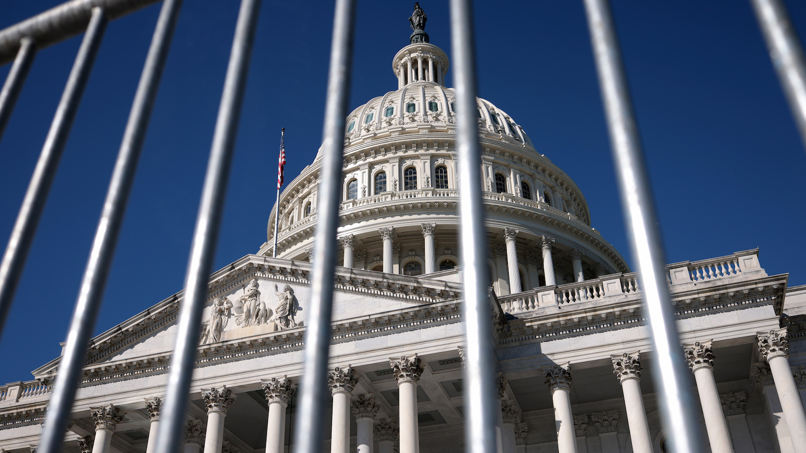 Capitol building through a fence