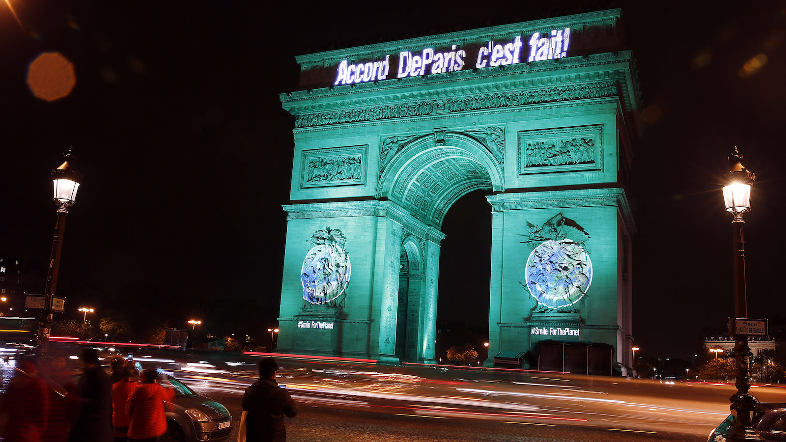 The Arc de Triomphe illuminated with the words 
