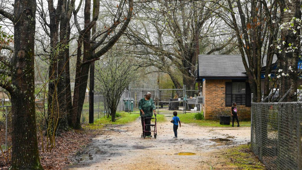 Lowndes County residents walking down a path