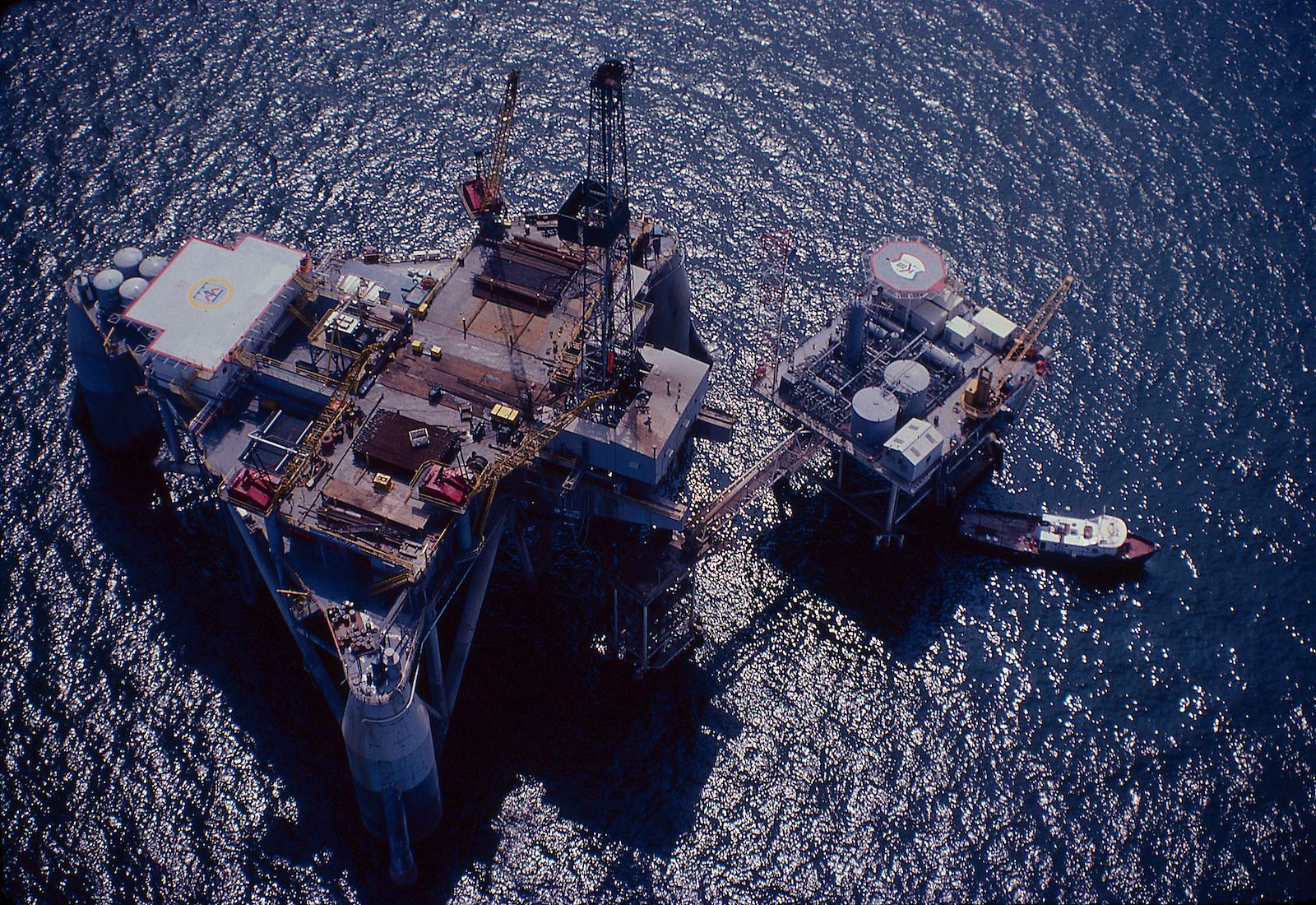 Offshore drilling rig next to a production platform in Gulf of Mexico.