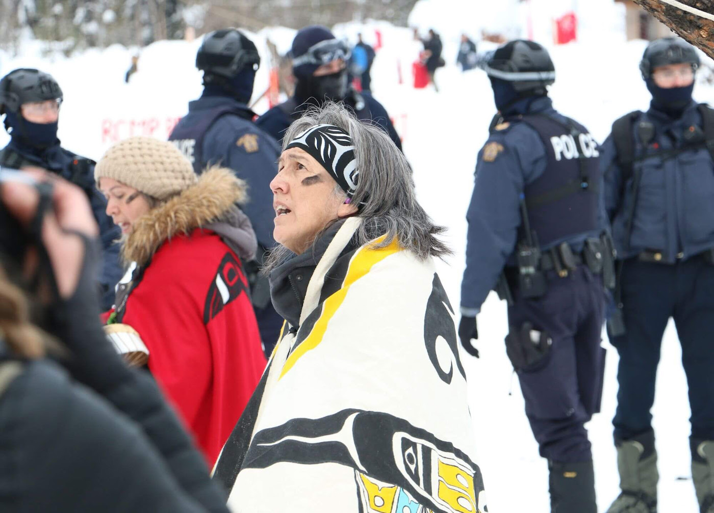 At a protest against British Columbia’s Coastal GasLink pipeline project in February, Freda Huson, a hereditary chief of the Wet'suwut'en First Nation, was the last person singing by a sacred fire when she was arrested by police. The policy included tactical squad officers armed with rifles and handlers with dogs, arriving in a convoy of more than 30 vehicles as a helicopter circled overhead — An example of BC’s increasingly muscular protest takedowns.