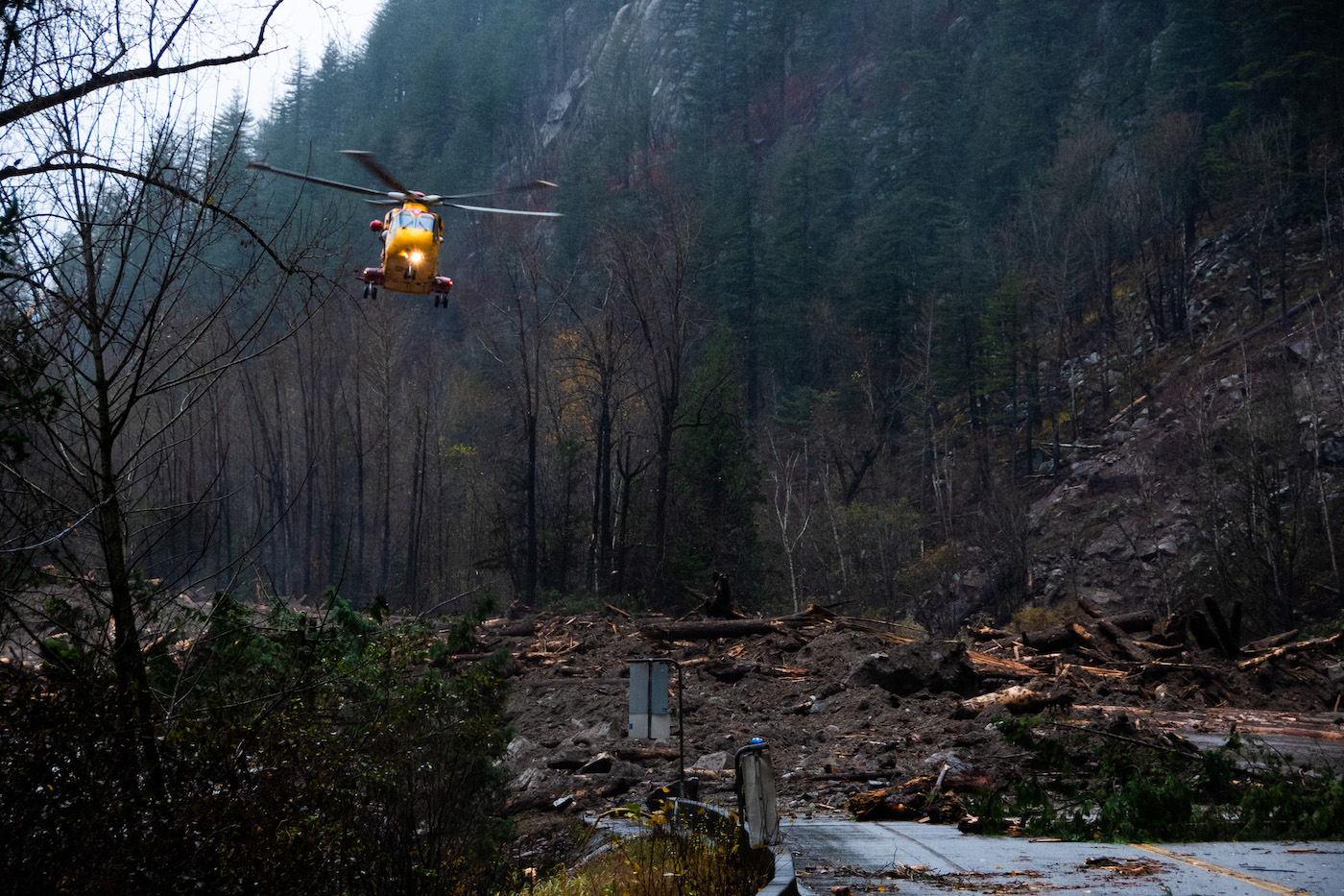 A Royal Canadian Air Force helicopter evacuated 311 people plus animals from a blocked road after a landslide near Agassiz, British Columbia on November 16, 2021. Every highway and rail line linking coastal BC to the rest of Canada washed out in November after an ‘atmospheric river’ — an extended storm linked to climate change — dumped a month’s worth of rain on southern BC in just two days.