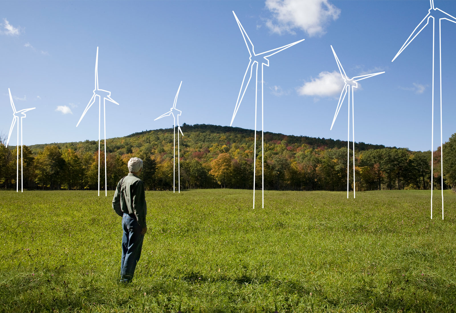 Man looking at landscape with illustrated wind turbines