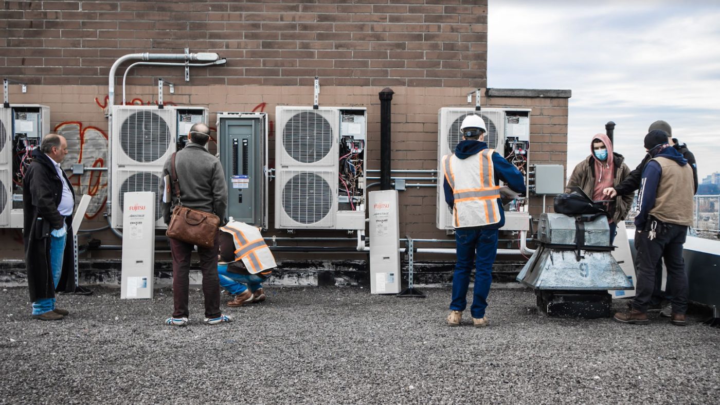 HVAC workers on a rooftop