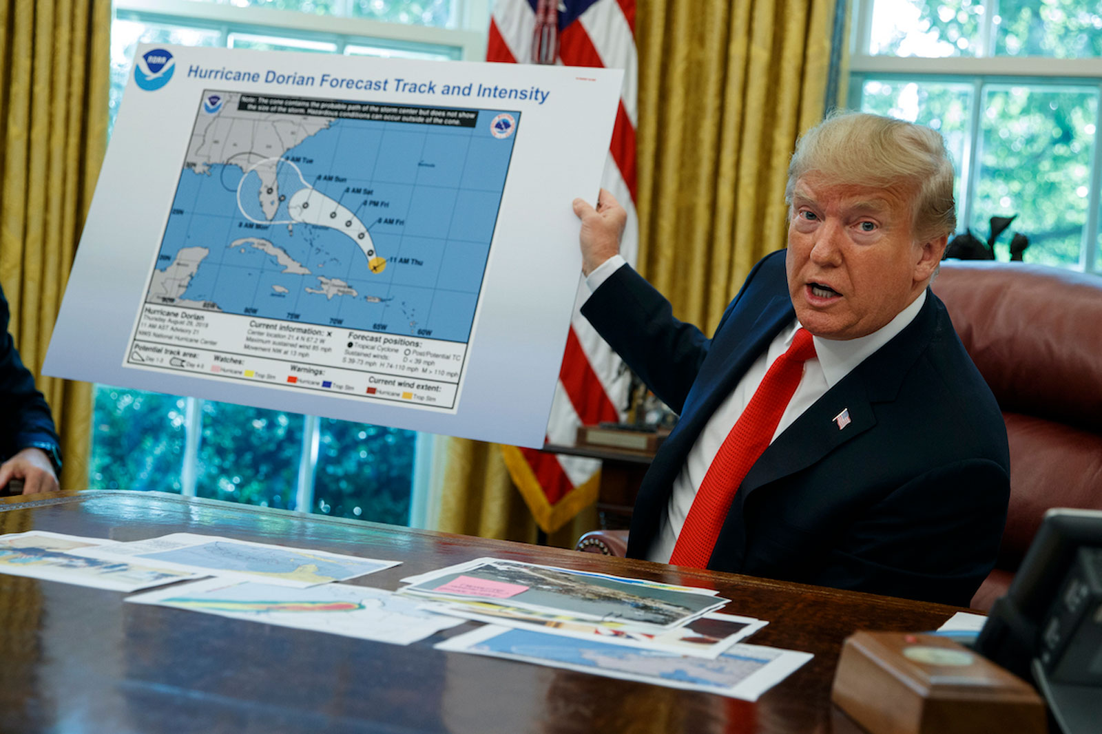 Trump holding trajectory map of Hurricane Dorian