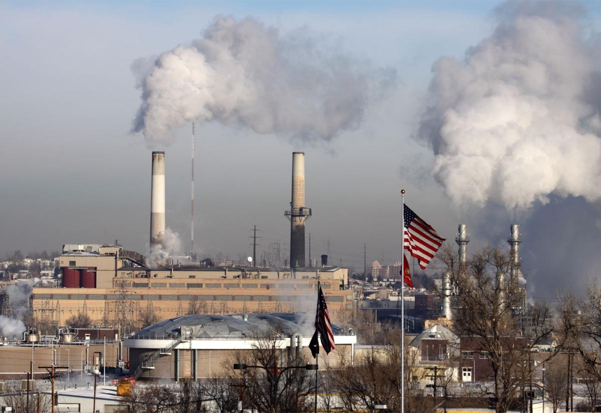 Coal plant with American flag in foreground