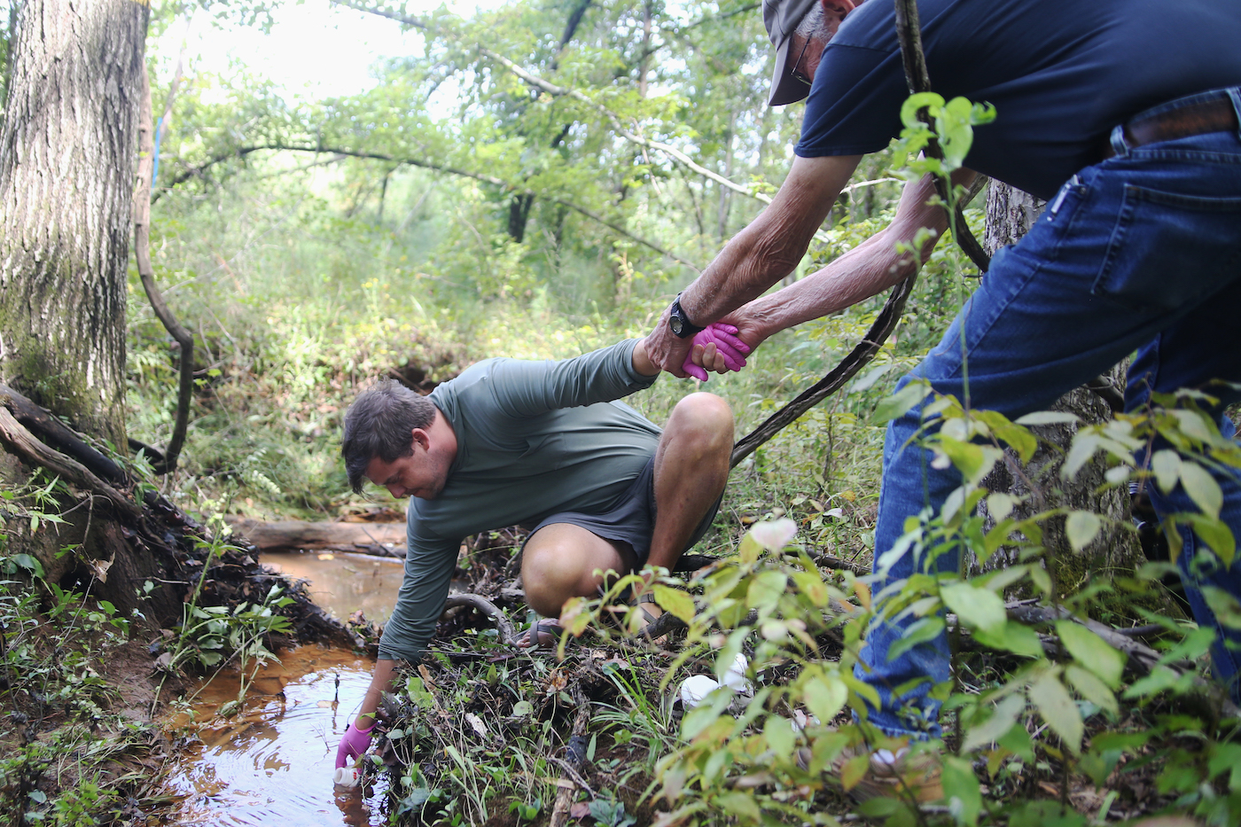 Fletcher Sams of the Altamaha Riverkeeper samples water near Plant Scherer for contaminant testing.