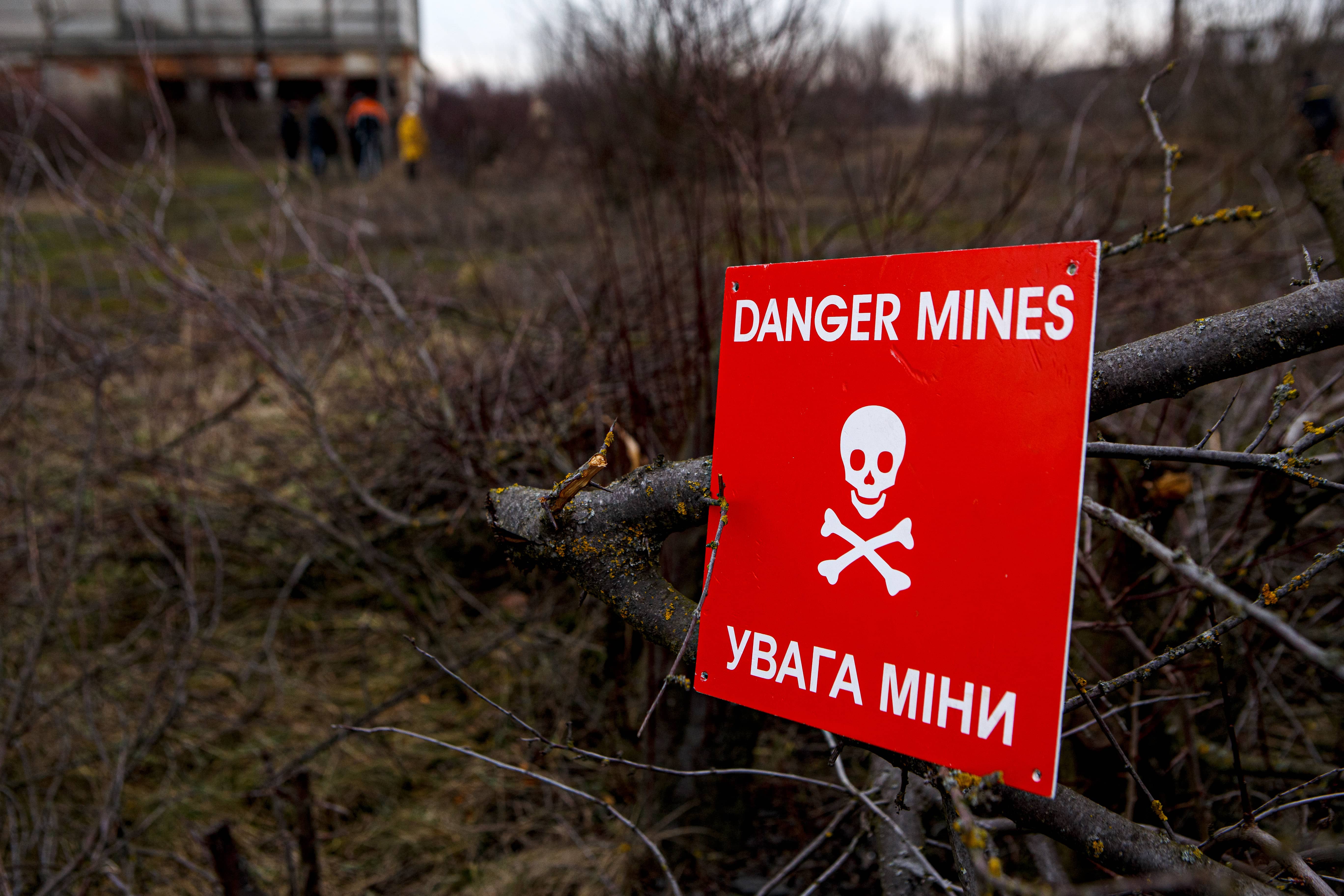 A red 'Danger Mines' sign pictured during a military drill for civilians carried out in western Ukraine.