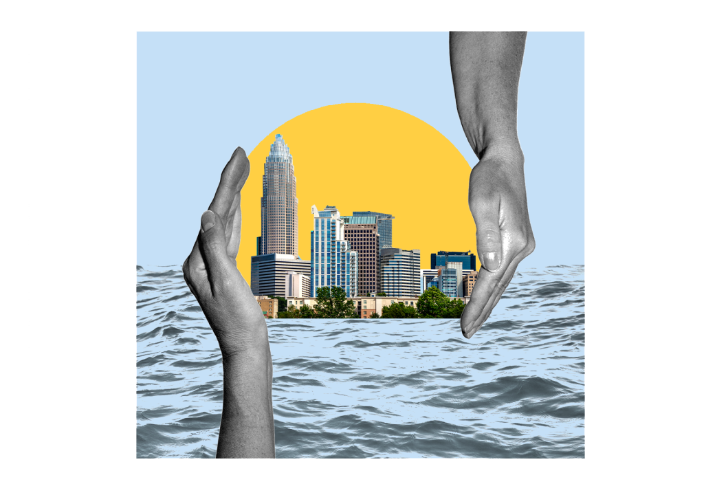 Hands protecting a city surrounded by water