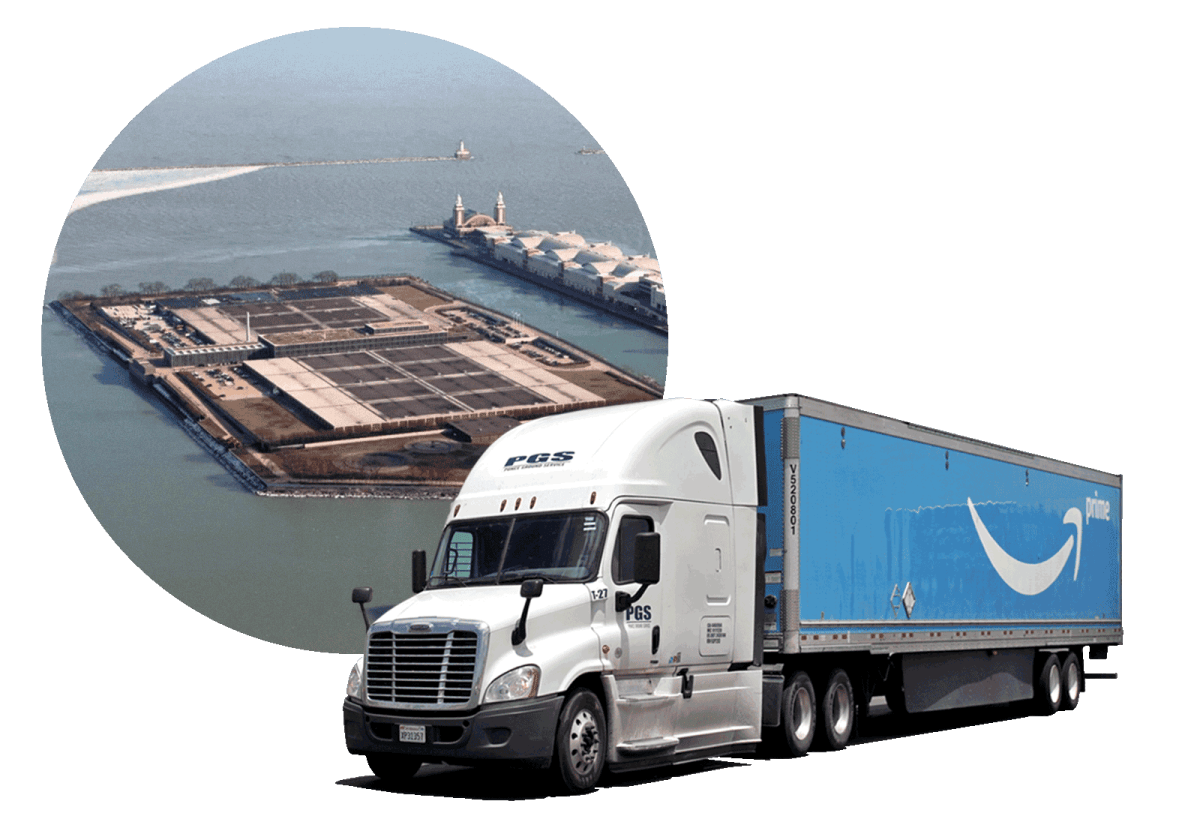 aerial view of a piece of land with industrial equipment jutting into water and an Amazon semi truck