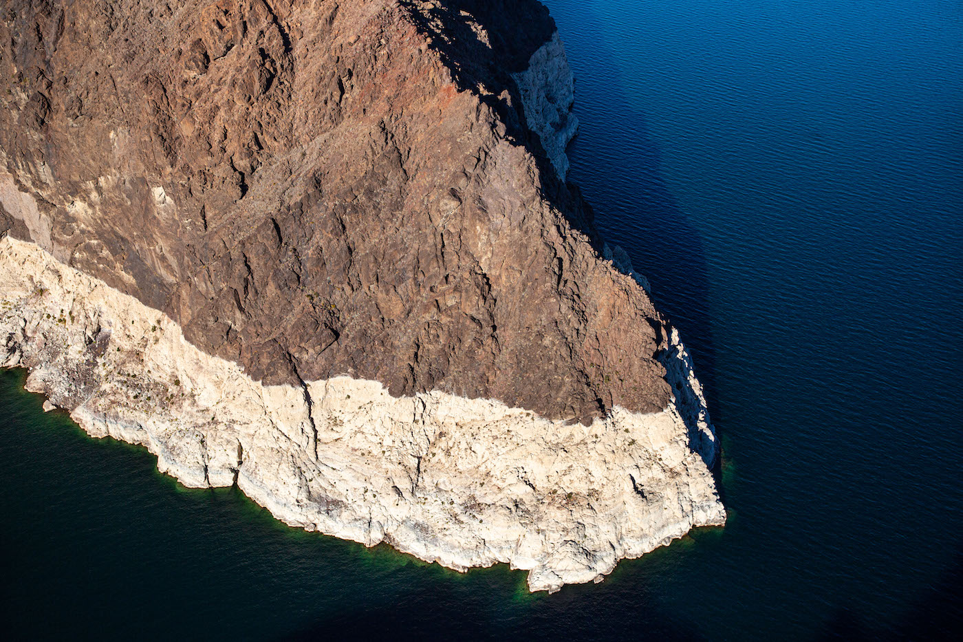 Aerial view: Lake Mead is a water reservoir formed by Hoover Dam on the Colorado River in the Southwestern United States and is viewed at 30% capacity on January 11, 2022 near Boulder City, Nevada.
