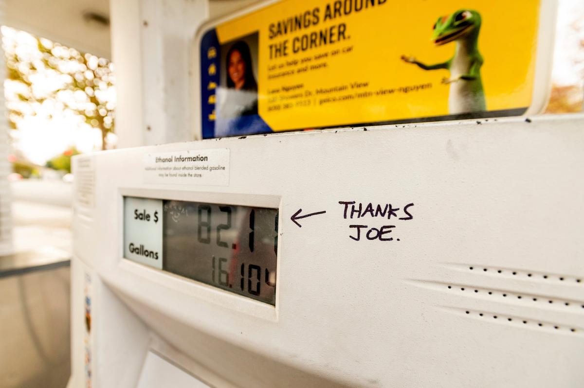 a white gas pump with a hand-drawn message in black pen saying "thanks joe" and pointing at the price screen