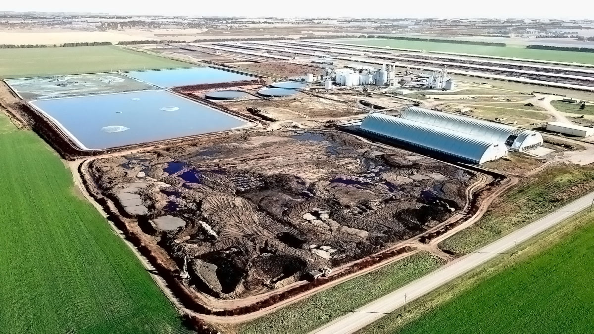An aerial view of the AltEn facility, surrounded by green fields.