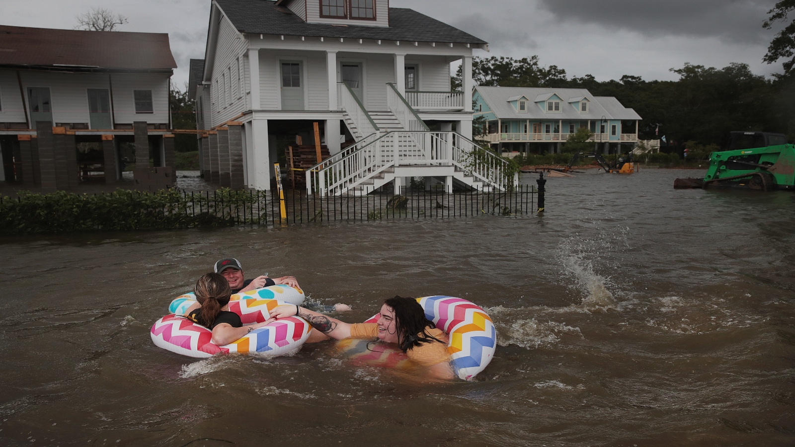People float in inner tubes down Lakeshore Drive in Mandeville, Louisiana, which flooded in the wake of Hurricane Barry in July 2019.
