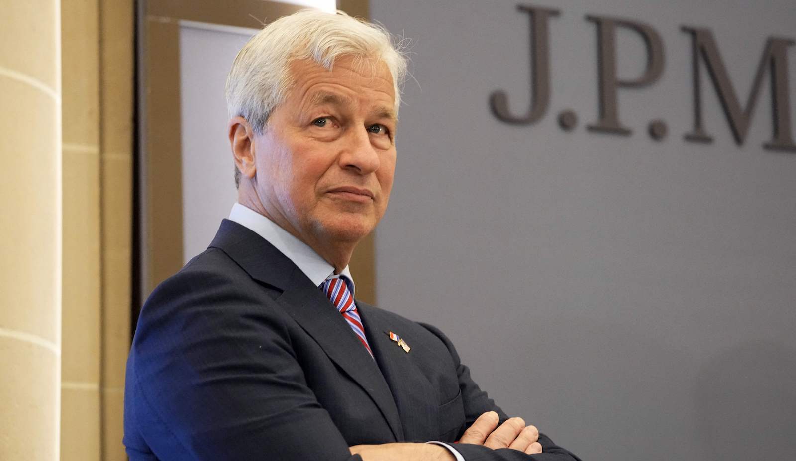 JPMorgan CEO Jamie Dimon stands with his arms cross