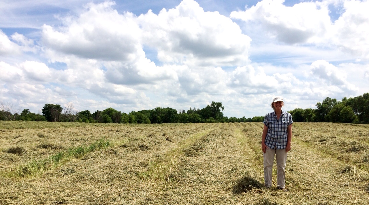 Lisa Doerr stands in a hay field in Wisconsin.