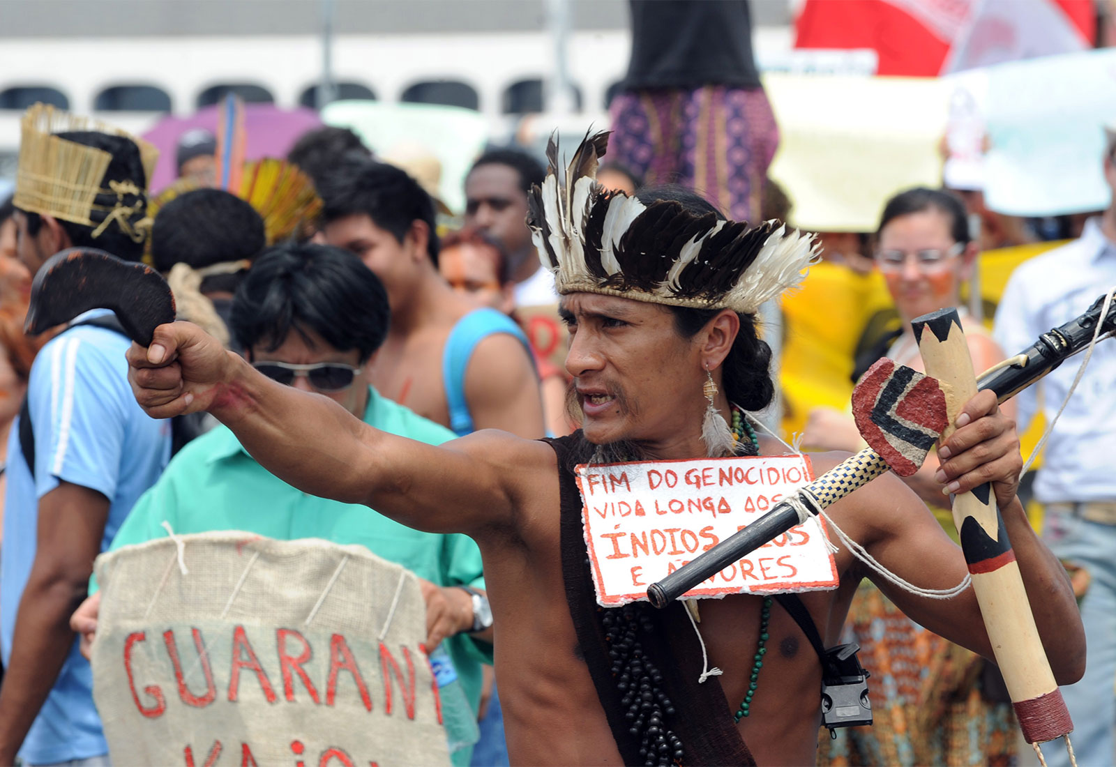 Crowd of people protesting the treatment of the Guarani-Kaiowa tribe in Brazil