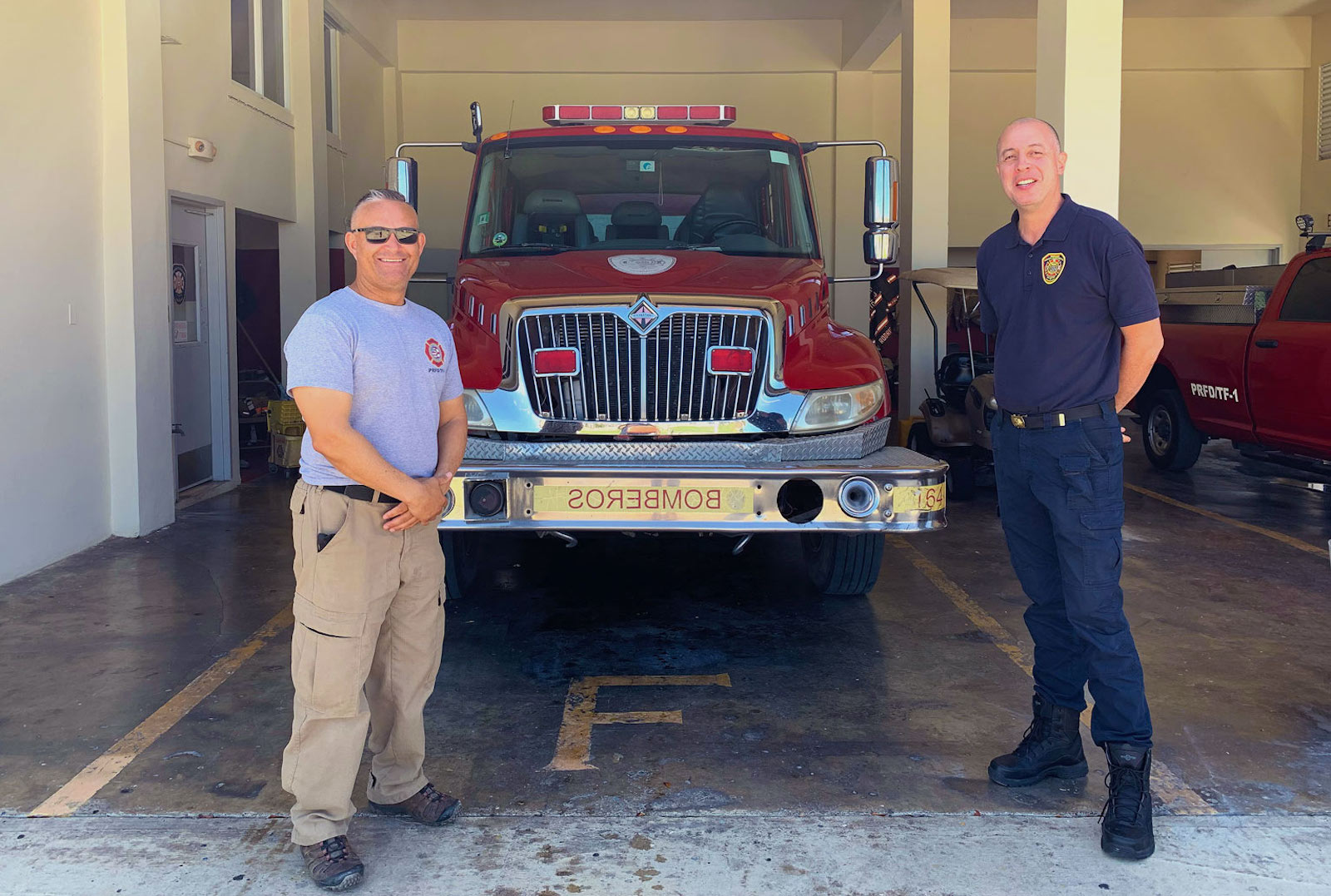 Sergeant Luis Saez, left, and Edgardo Gelabert Santiago are on duty at the solar-powered fire station in Guánica, Puerto Rico.