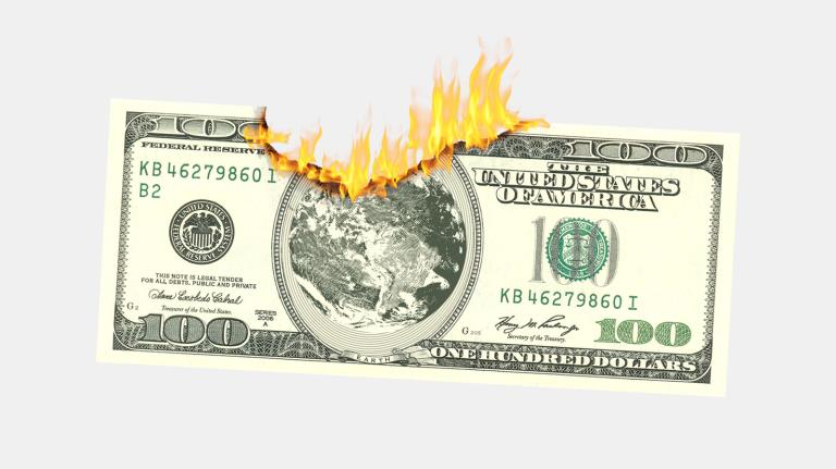 Photoshopped 100 dollar bill with top center edge burnt away and on fire, with Earth in the center instead of Ben Franklin