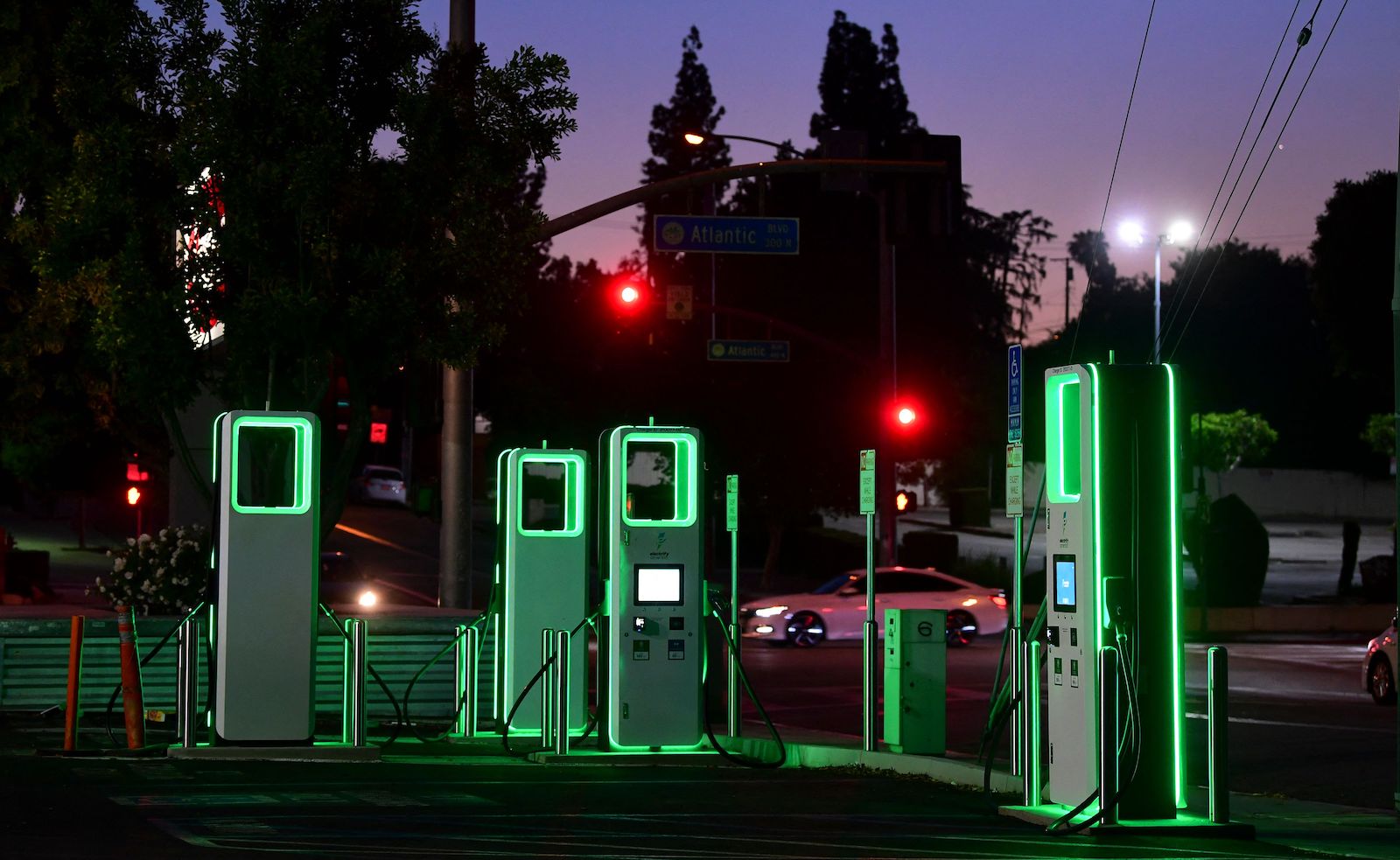 electric vehicle charging stations lit up in green