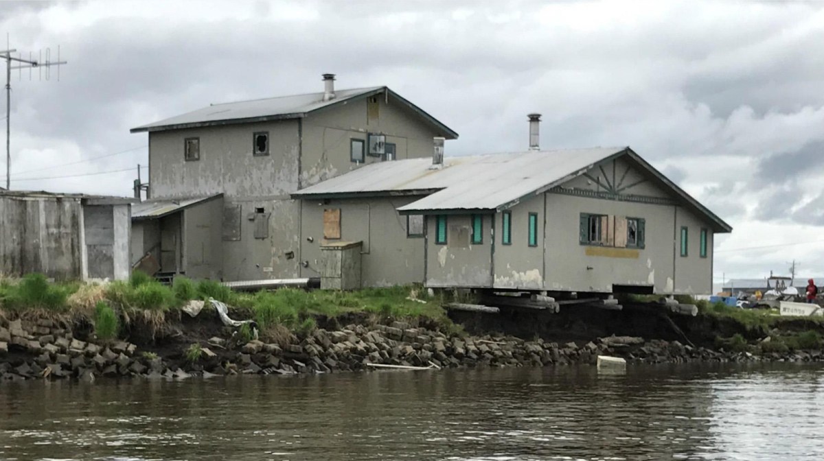 In Kotlik, Alaska, pictured here, many houses and other buildings hang precipitously over the water as the ground beneath them washes away.